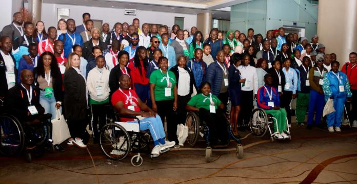 More than 50 people pose for a group photo